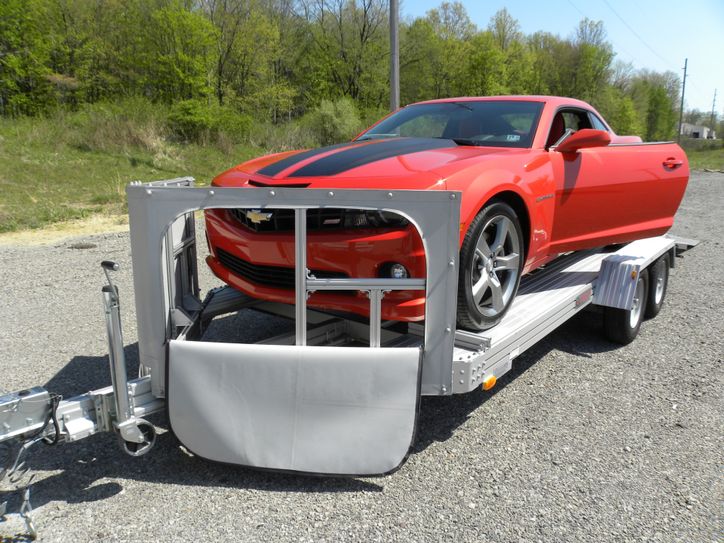 Open trailer front shield unzipped for loading